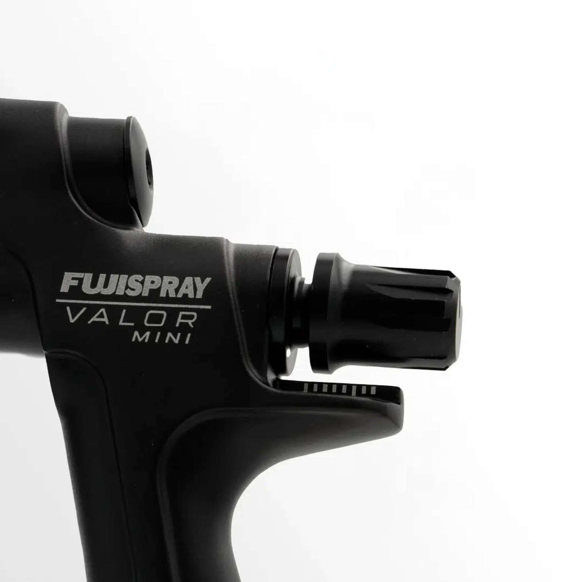 Close-up of the FUJISPRAY VALOR MINI marking on the gun body.