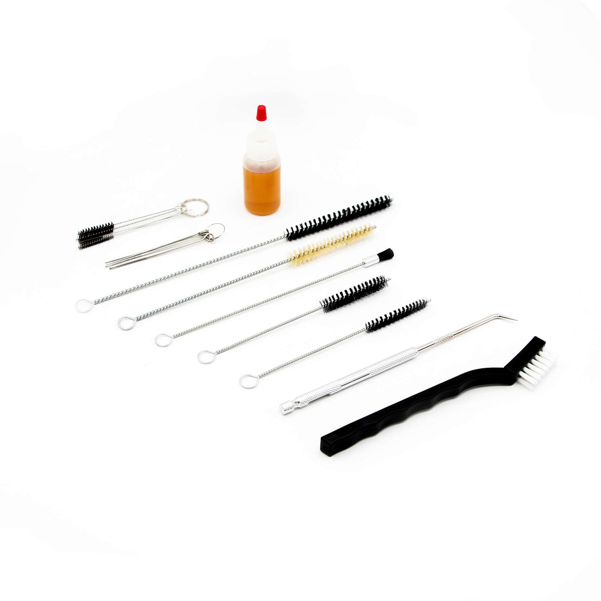 The Fuji Spray 19-piece gun cleaning kit laid out: brushes, needle picks and a bottle of lubricant.