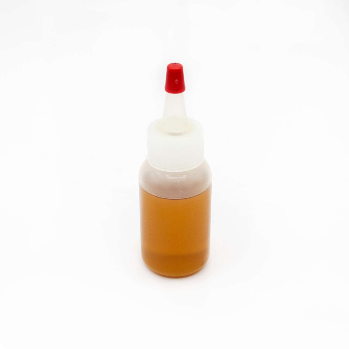 Bottle of Fuji Spray gun lubricant with a red applicator cap.